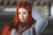 © Sergey - portrait of offended young girl with bright red hair, retro toned