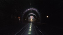 Extreme Train Coming Towards Camera In A Railway Tunnel. Representing Achieving Your Goals, Getting Through Problems And Obstacles Or Problems Seem Bigger Than They Really Are