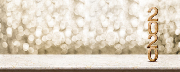 Poster - Happy New Year 2020 wood with sparkling star on marble table with gold bokeh background,Holiday festive celebration concept.Banner mock up for display of product or design content