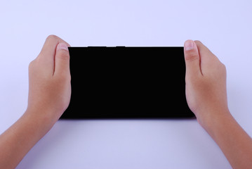 Hand holding a smartphone with blank screen