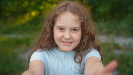 cute curly girl showing thumbs up.