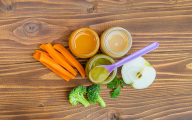 Wall Mural - Baby food. Mashed vegetables and fruits in jars. Selective focus.