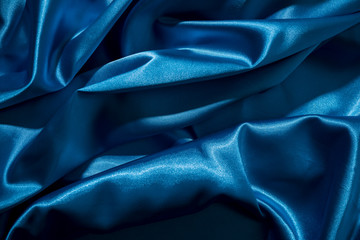 Wall Mural - Background image of crumpled fabric. Blue silk