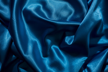 Wall Mural - Background image of crumpled fabric. Blue silk