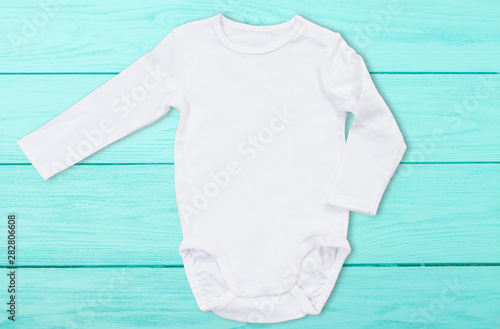 White Baby Mock Up Jumpsuit On Blue Wooden Background Baby Bodysuit Mockup And Template Blank Copy Space Top Front View One Piece Newborn Shirt Clothes Mock Up Buy This Stock Photo And Explore