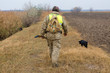 © Mountains Hunter - Hunter with a german drathaar and spaniel, pigeon hunting with dogs in reflective vests