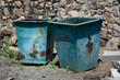 old rusty iron trash cans