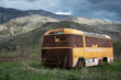 postapocalyptic old rusty bus, mountain landscape