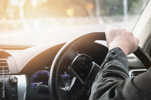 Fotografía Driver hand hold steering wheel to control and turn right on sharp curve road
