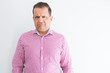 © Krakenimages.com - Middle age man wearing business shirt over white wall depressed and worry for distress, crying angry and afraid. Sad expression.