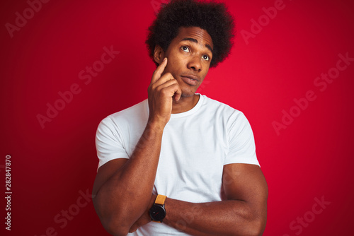 Young American Man With Afro Hair Wearing White T Shirt Standing