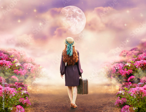 Redhead lady woman in polka dot dress, hat, retro style suitcase walk summer rose field path to mystical glow. Tranquil fantasy fairy tale scene, big giant moon. Travel across hills to dream concept