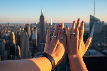 Hands with weeding rings with the Empire State in the background