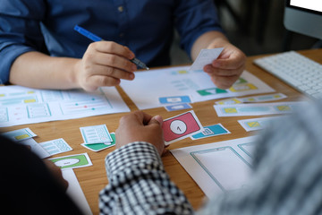user experience UX designer designing web on smart phone layout. UI developer planning working on mobile application prototype