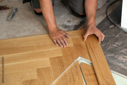 Worker Laying Parquet Flooring Worker Installing Wooden Laminate