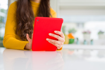 Wall Mural - Beautiful young woman working using touchpad tablet