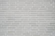 gray clinker brick wall background - modern building exterior with brick slip cladding