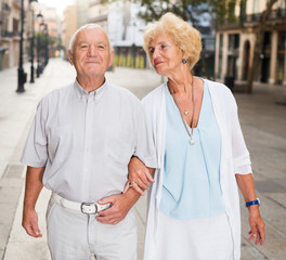 Wall Mural - loving mature spouses enjoying walk