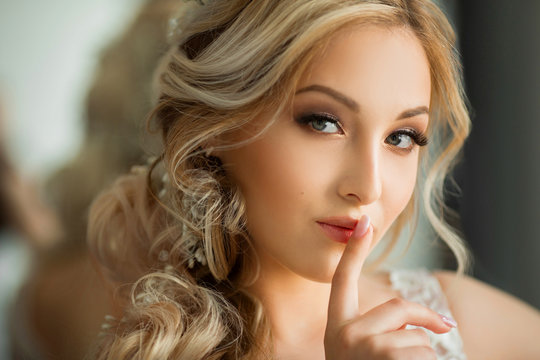 portrait of a beautiful young woman with makeup and hairstyle