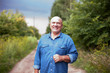 © DariaTrofimova - mature man on   country road