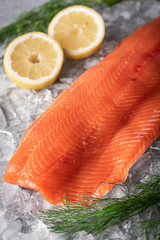 Wall Mural - raw salmon fillet on gray background