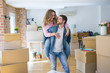 © Krakenimages.com - Young couple moving to a new house, boyfriend giving a piggy back ride to girlfriend, very happy and cheerful for new apartment
