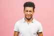 © denis_vermenko - Sad depressd afro american man isolated over pink background.
