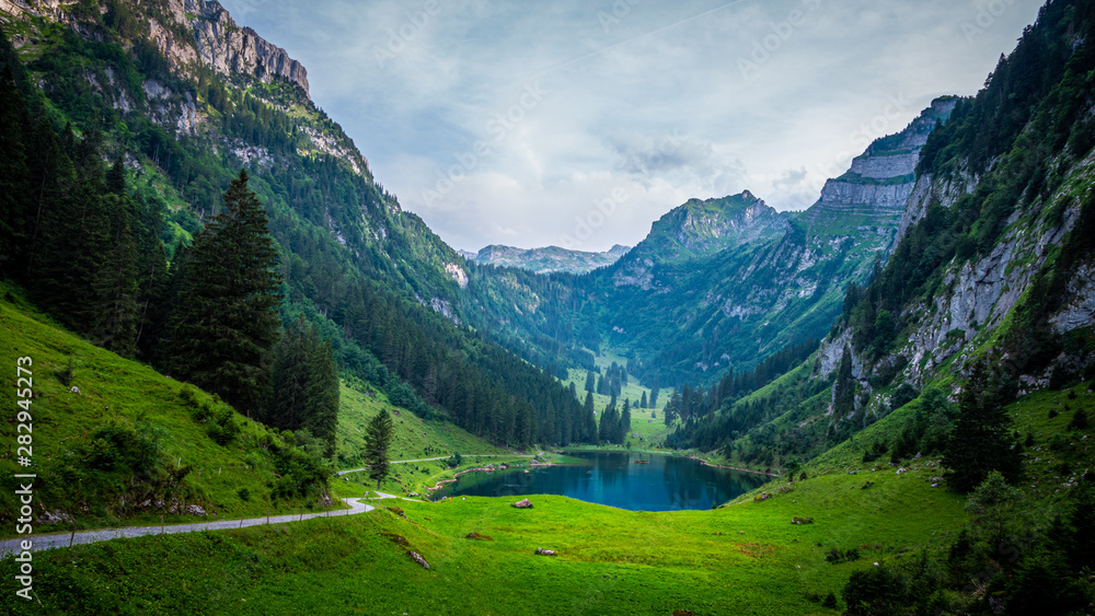 Beautiful mountain lake in the Swiss Alps - very romantic - obrazy, fototapety, plakaty 