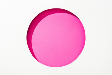 Poster - cut out round hole in white paper on pink colorful background