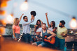 © NDABCREATIVITY - Having a great time with friends, havinf fun at rooftop party