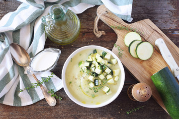 Zucchini vegetable cream soup, thyme and olive oil dressing