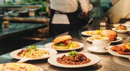 Food orders on the kitchen table in the restaurant