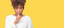 Beautiful Young African American Woman Wearing Winter Sweater Over Isolated Background Asking To Be Quiet With Finger On Lips. Silence And Secret Concept.