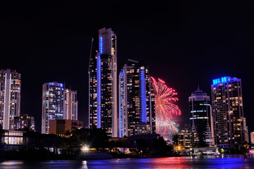 Fireworks exploding behind two buildings Gold Coast, Australia