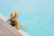 © siraphol - Portrait asian beautiful young woman happy smile relax around outdoor swimming pool in holiday vacation