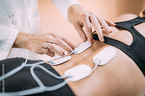 Lower Back Physical Therapy with TENS Electrode Pads, Transcutaneous Electrical Nerve Stimulation