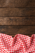 Red Checkered Tablecloth On Wooden Background With Copyspace