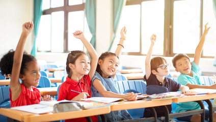 happy elementary school kids  in classroom