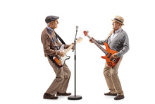 Two Elderly Men Having A Jam Session With Electric Guitars