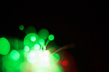 Wall Mural - Bright green bokeh lights; abstract background