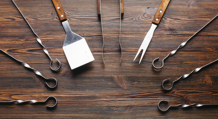 Barbecue utensil set on wooden table