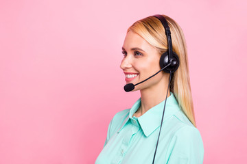 Profile side photo of professional manager having mic listen landline smiling wearing teal shirt isolated over pink background