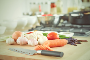 Wall Mural - Composition with wooden board and ingredients for cooking on ta