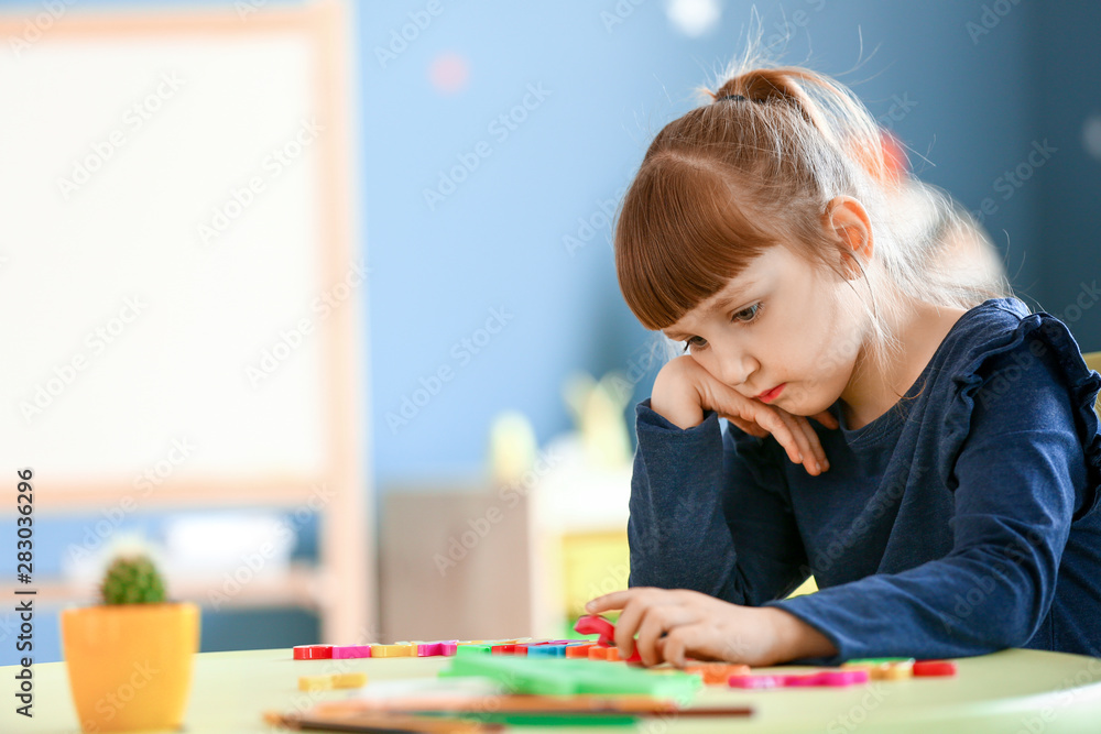 Little girl with autistic disorder in playroom