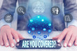 © Artur - Conceptual hand writing showing Are You Covered Question. Concept meaning asking showing if they had insurance in work or life Female human wear formal work suit presenting smart device