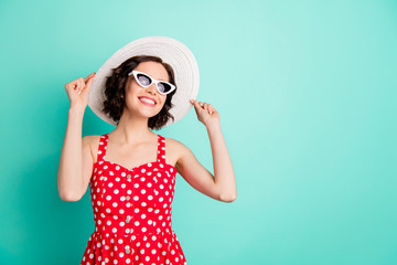 Photo of nice cheerful good enjoying girlfriend having relax abroad while sun rays are tenderly touching her face while isolated with teal background