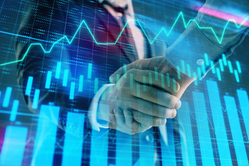 Multi exposure of forex graph on abstract background with two businessmen handshake. Concept of success on stock market