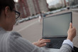 © Alexander - Young ambitious woman with a laptopworks on a laptop during a break.