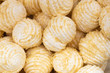 A pile of vanilla white delicious marshmallows in a waffle crumb closeup, background