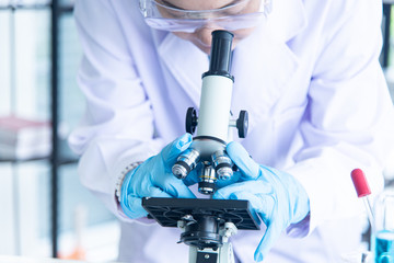 Asian woman scientist, researcher, technician, or student conducted research in laboratory